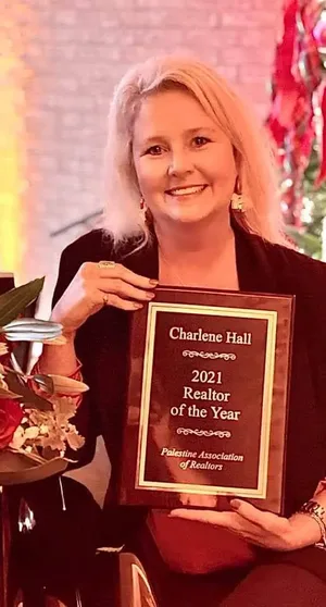 Charlene Hall receiving the 2021 REALTOR® of the Year award from the Palestine Association of REALTORS®