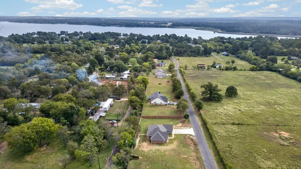Aerial view along the county road near 281 ACR 308 with Lake Palestine in the distance.