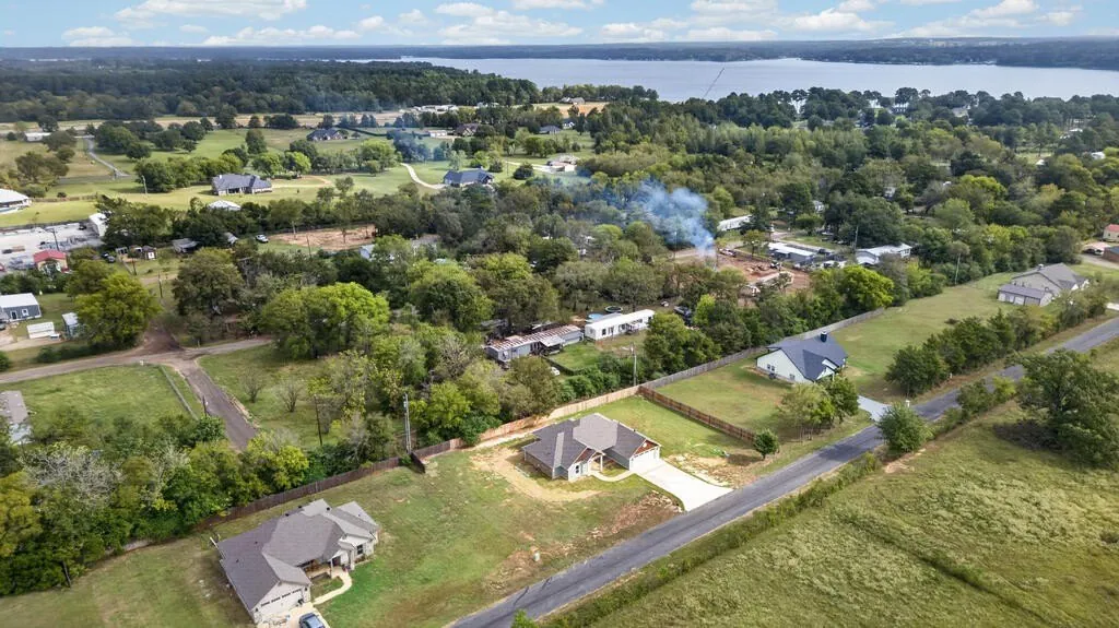 Aerial view of the lot and surrounding area at 281 ACR 308, with Lake Palestine in the distance.