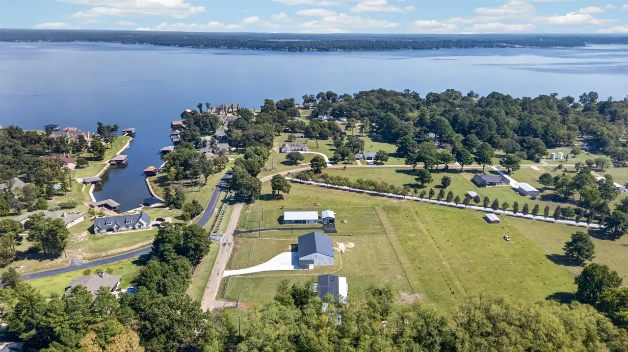 Aerial view looking over the property toward Lake Palestine and the coves of Brown's Landing at 21138 County Road 4202 in Chandler, TX, across from Brown's Landing on Lake Palestine.