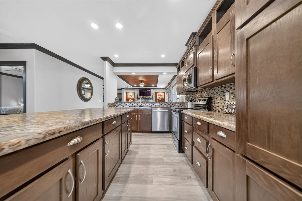 Long run of kitchen cabinets and counters at 21138 County Road 4202 in Chandler, TX, across from Brown's Landing on Lake Palestine.