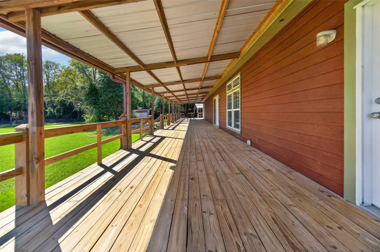 The 47-foot covered rear deck running the length of the home at 21138 County Road 4202 in Chandler, TX, across from Brown's Landing on Lake Palestine.