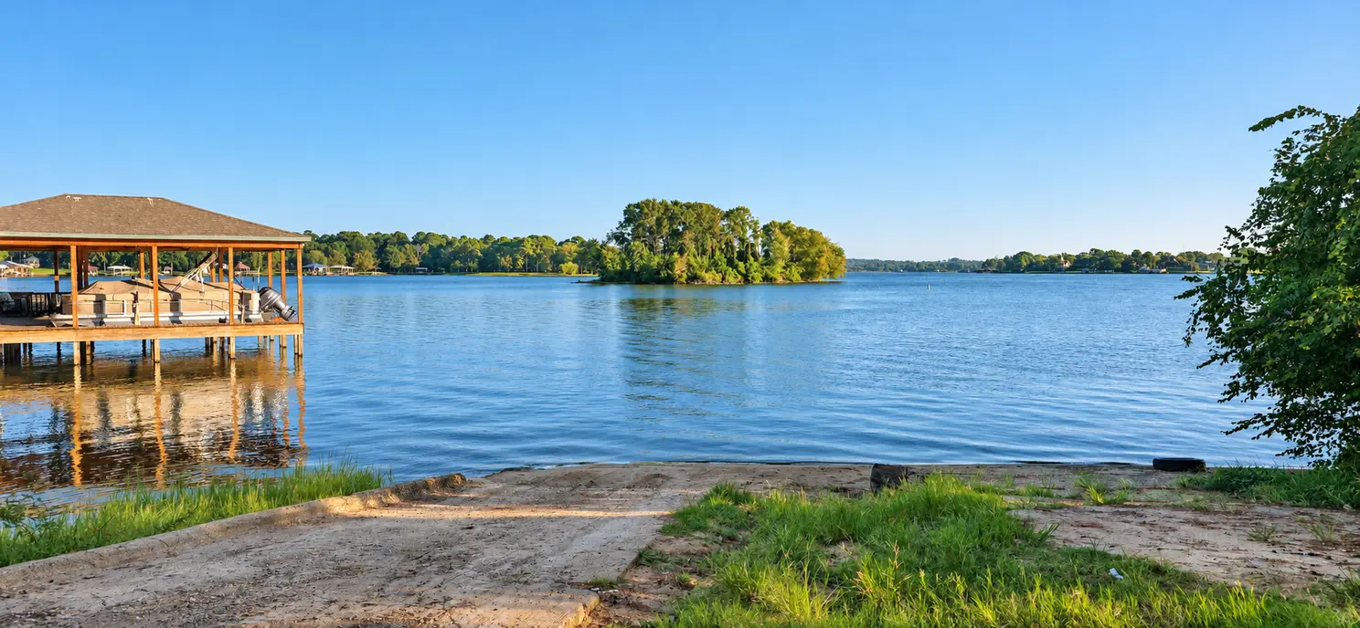 The Lakeway Harbor community boat ramp on Lake Palestine in Flint TX, with the island in view across the water.